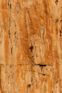 Climber on the rock faces of Monte Monaco at Capo San Vito, Sicily, Italy Climber on the rock faces of Monte Monaco at Capo San Vito, Sicily, Italy